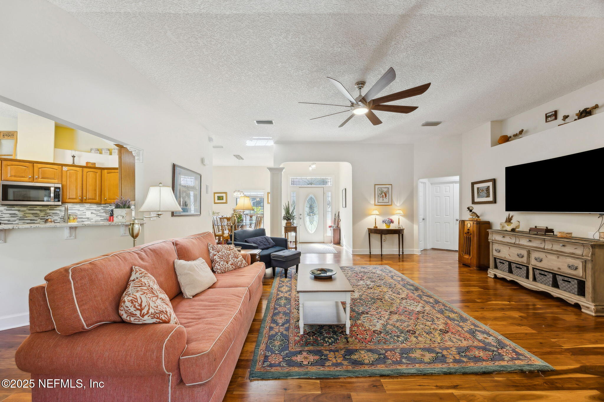 6897 Miltondale Road Macclenny, FL 32063 - Photo 11 of 58 a living room with furniture and a flat screen tv