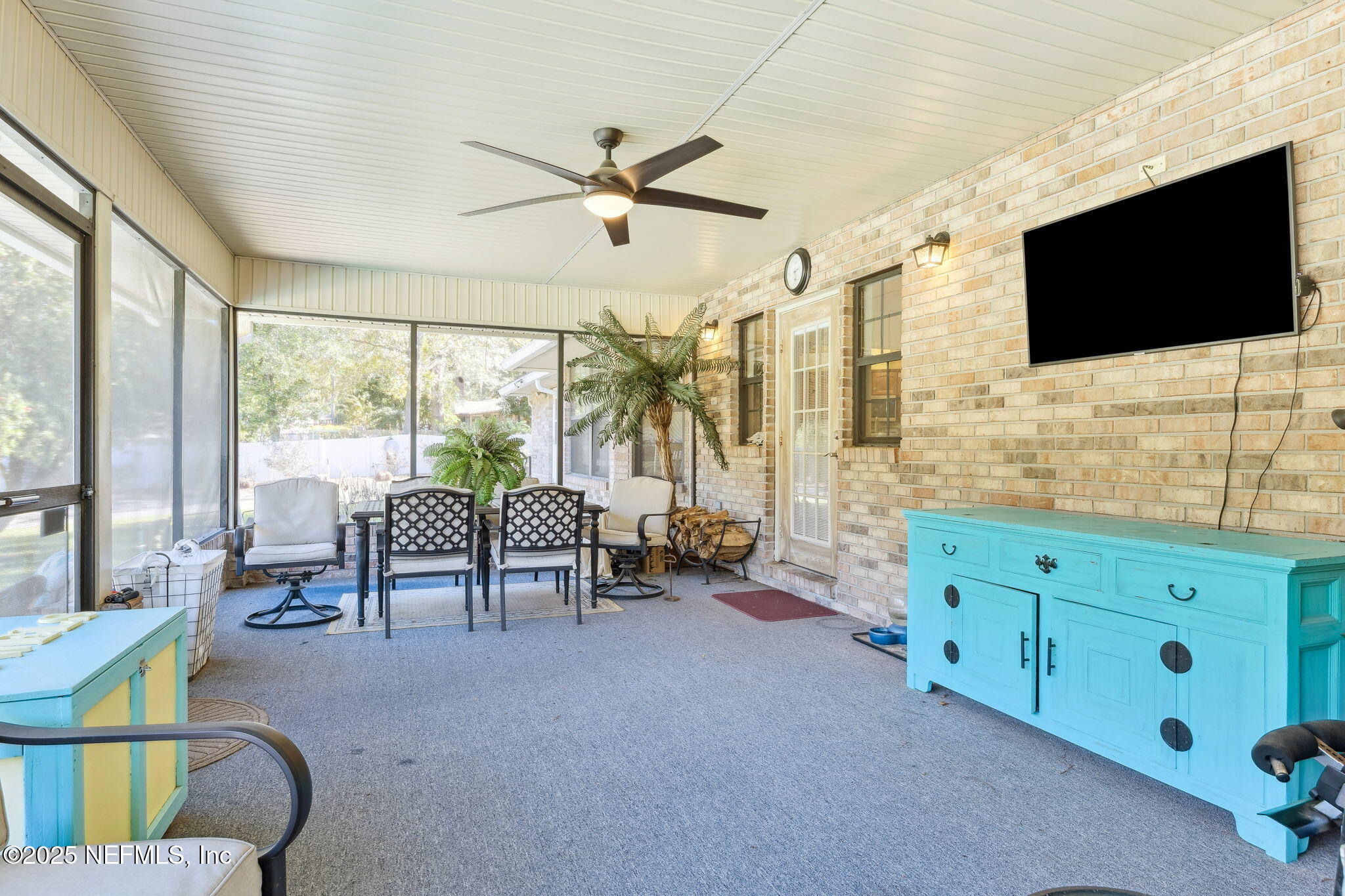 6897 Miltondale Road Macclenny, FL 32063 - Photo 15 of 58 a living room with furniture tv and a flat screen tv