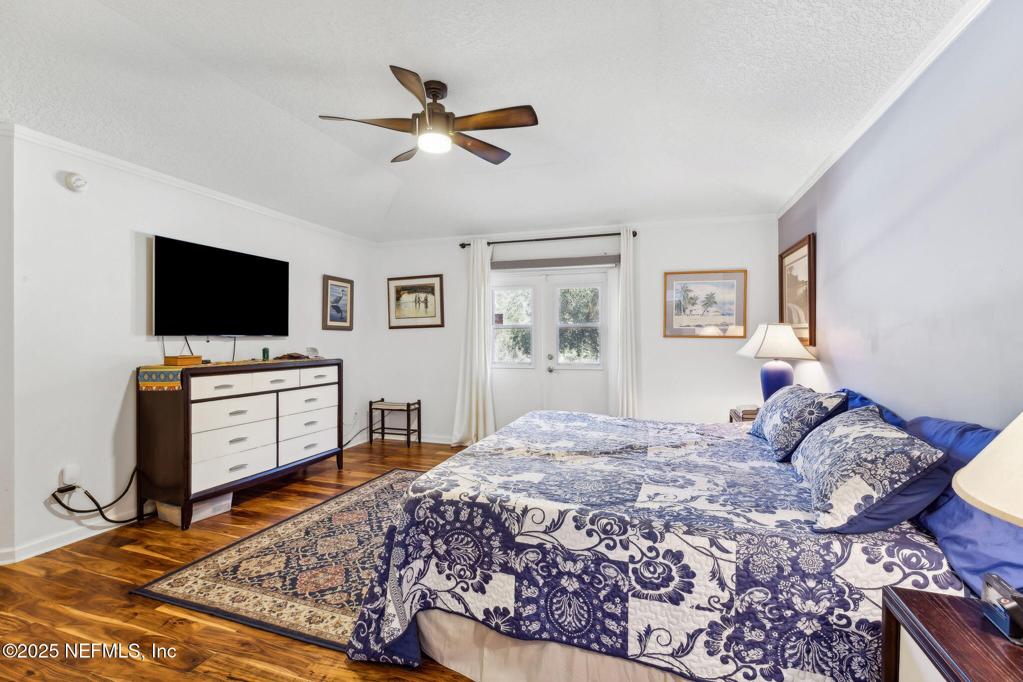 6897 Miltondale Road Macclenny, FL 32063 - Photo 18 of 58 a bedroom with a bed and a flat screen tv