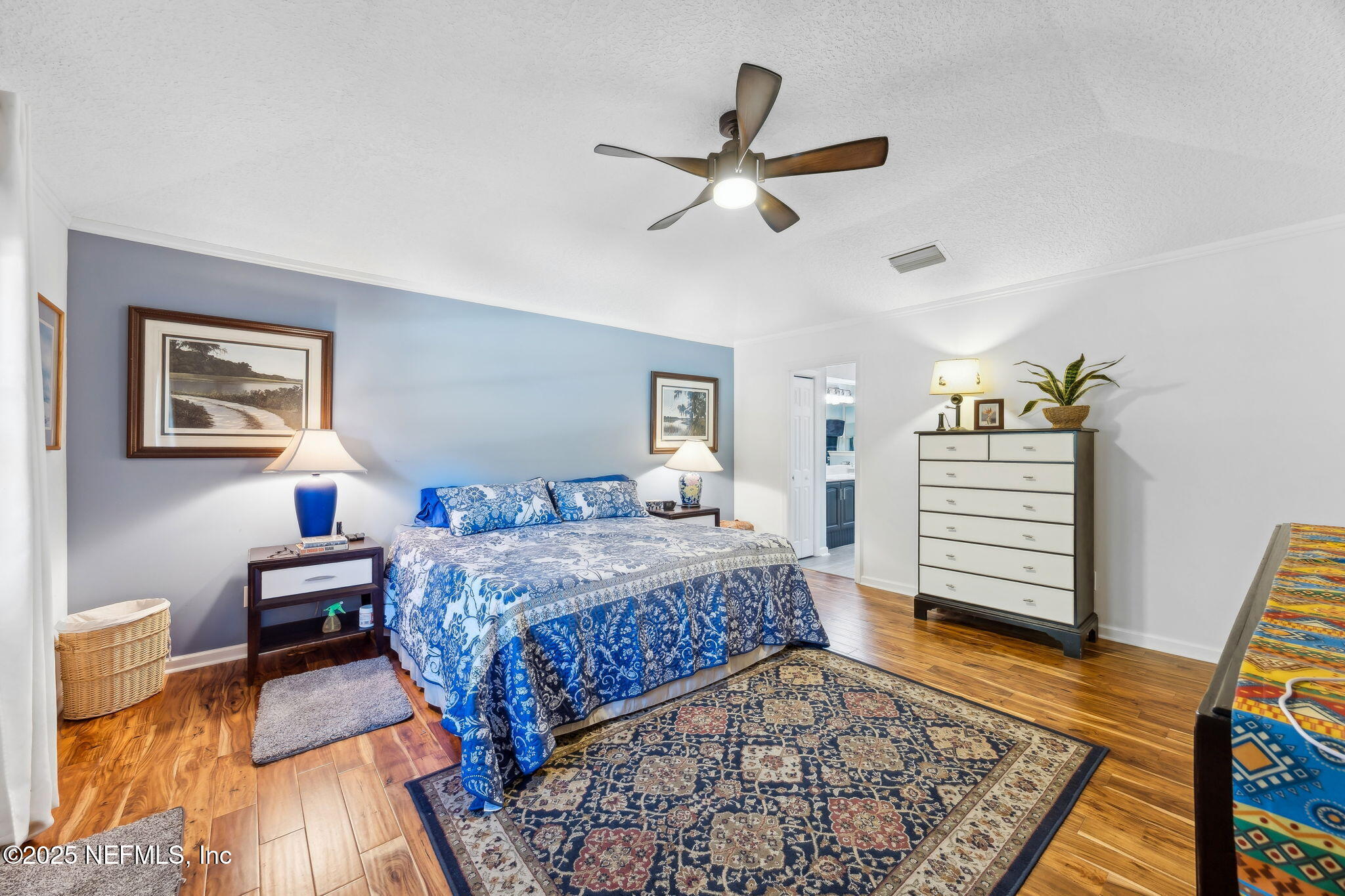 6897 Miltondale Road Macclenny, FL 32063 - Photo 19 of 58 a bedroom with a bed and wooden floor