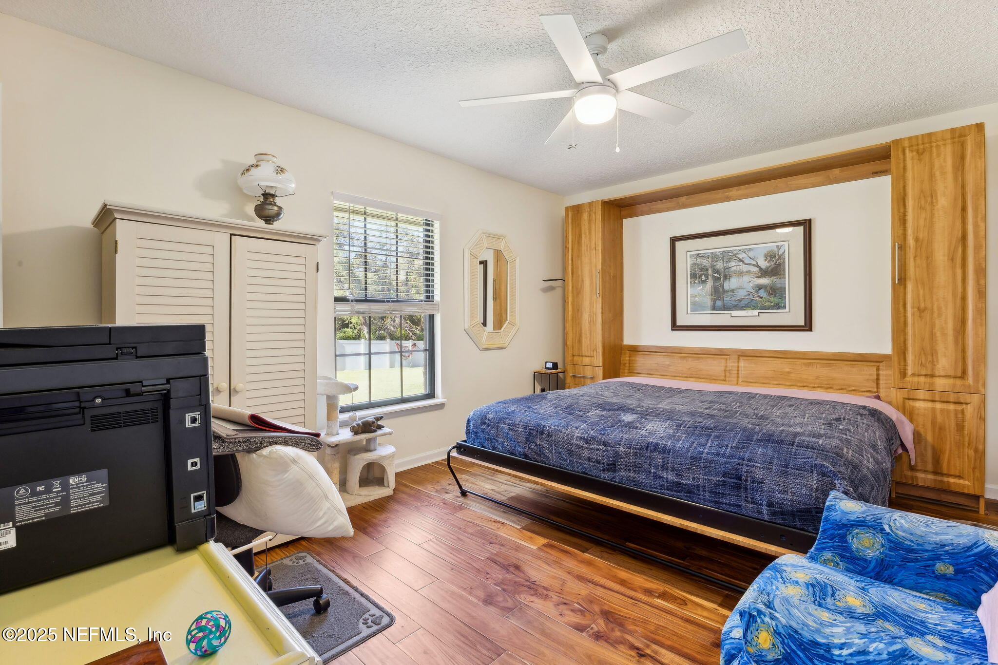 6897 Miltondale Road Macclenny, FL 32063 - Photo 21 of 58 a living room with a bed furniture and a window