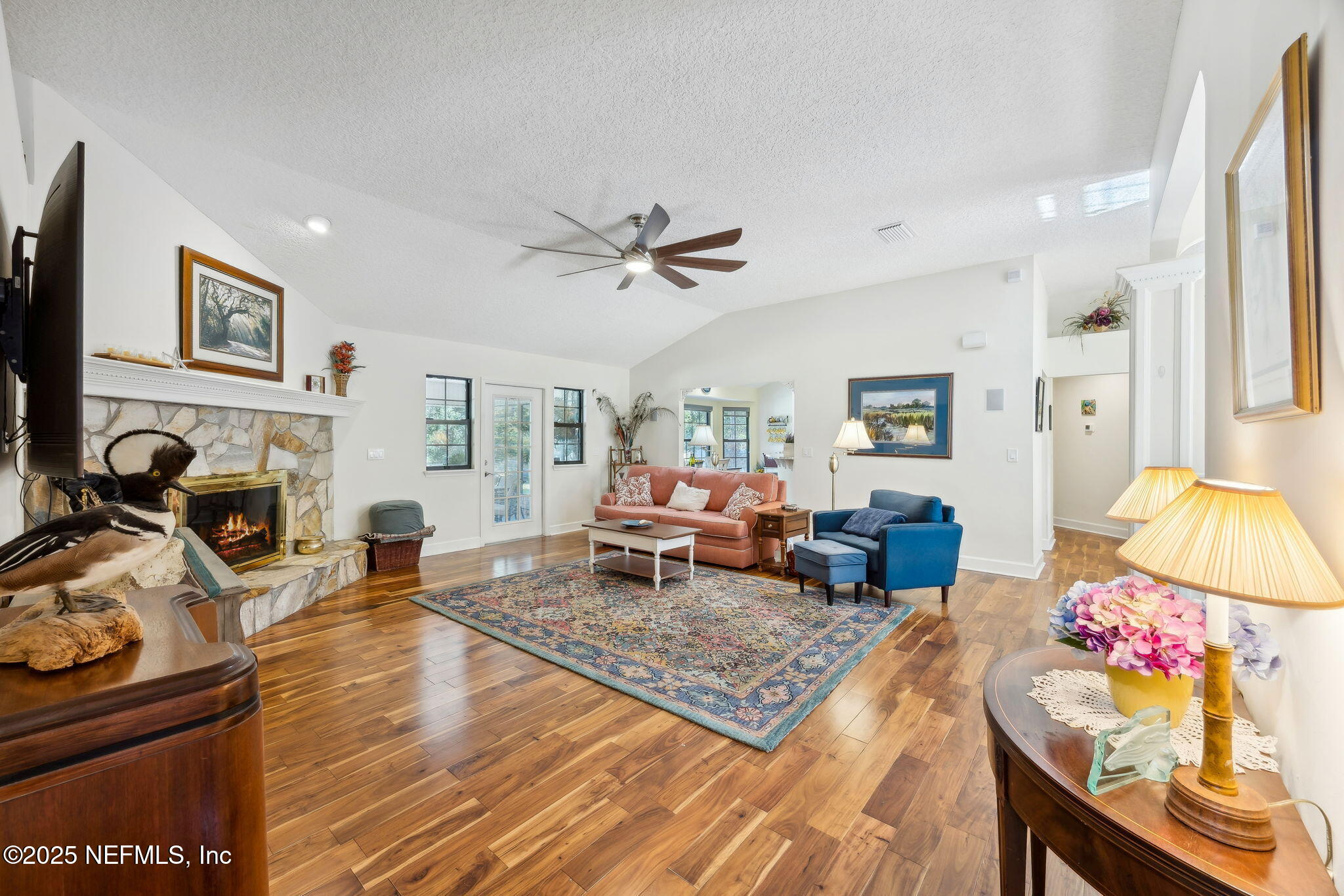 6897 Miltondale Road Macclenny, FL 32063 - Photo 25 of 58 a living room with furniture a rug and a flat screen tv