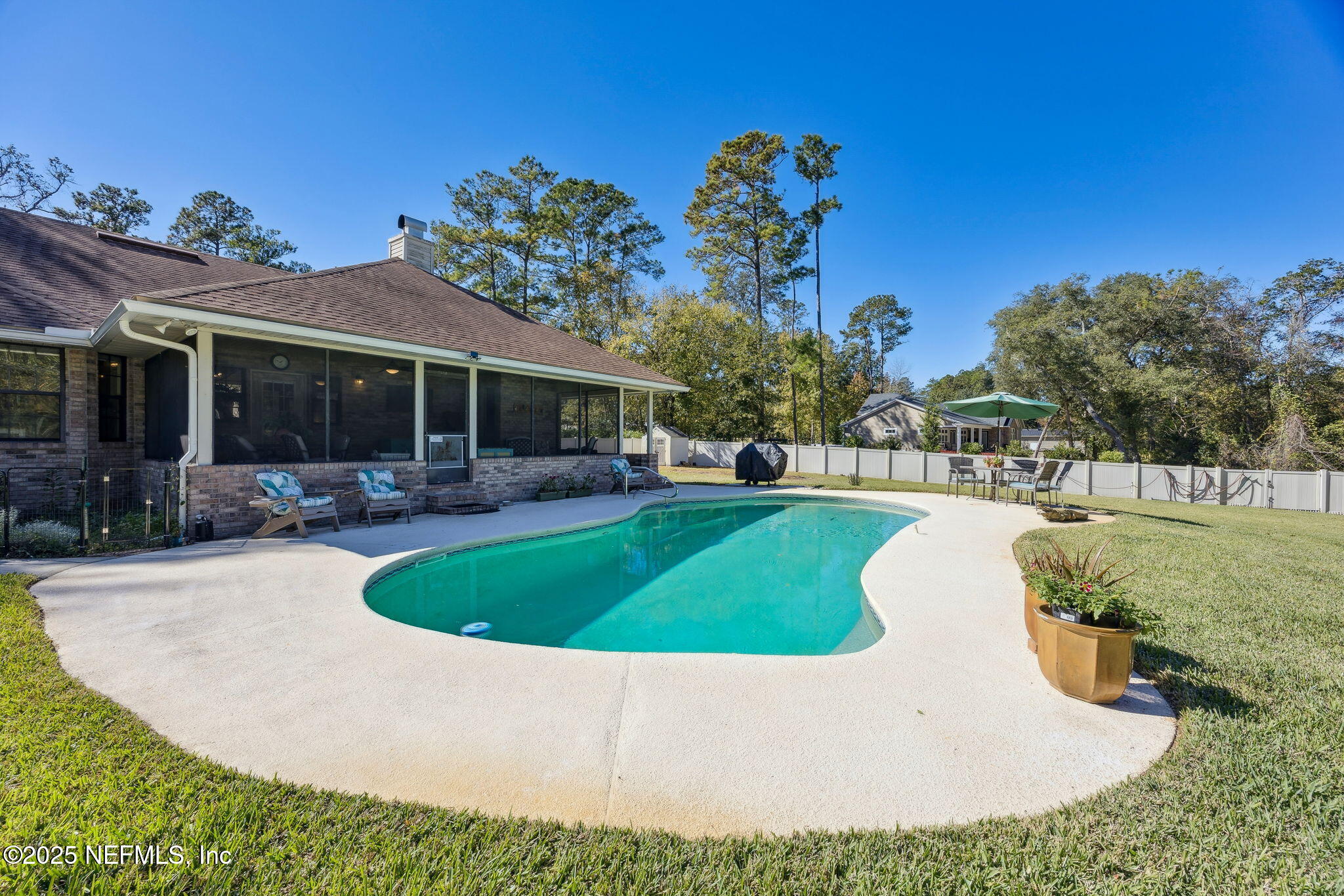6897 Miltondale Road Macclenny, FL 32063 - Photo 26 of 58 a view of a house with swimming pool and sitting area