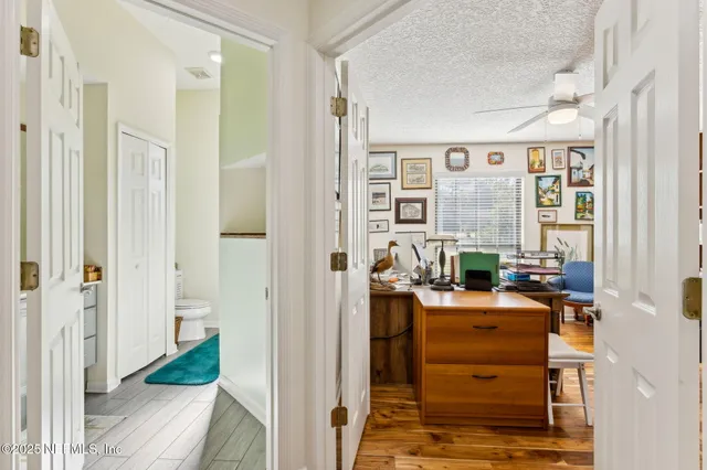a view of a large pool with an outdoor space and seating area