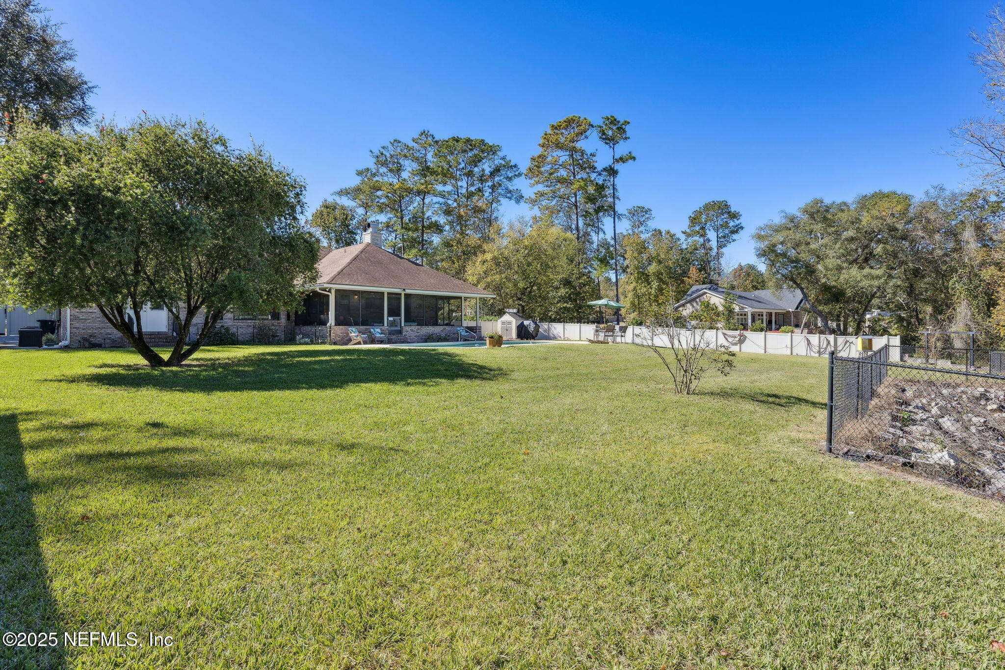 6897 Miltondale Road Macclenny, FL 32063 - Photo 31 of 58 a front view of a house with garden