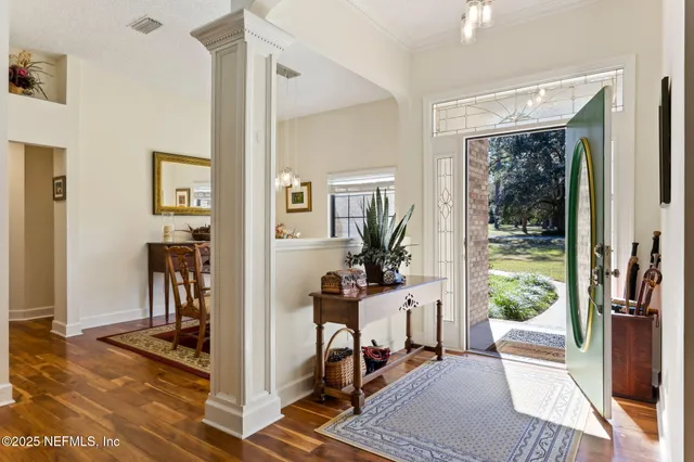 a view of a livingroom with furniture and a window