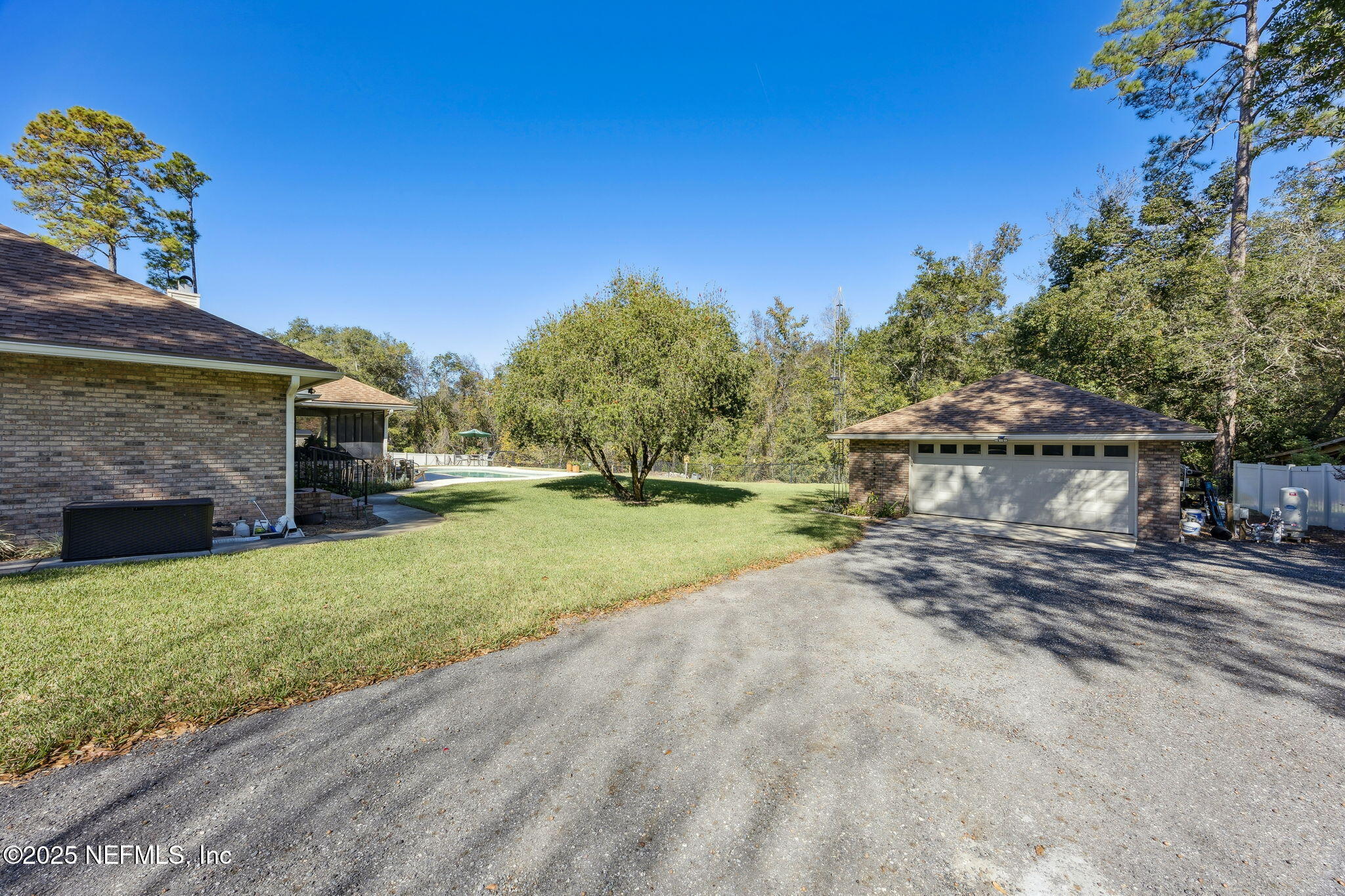 6897 Miltondale Road Macclenny, FL 32063 - Photo 41 of 58 a view of a house with backyard and a car parked