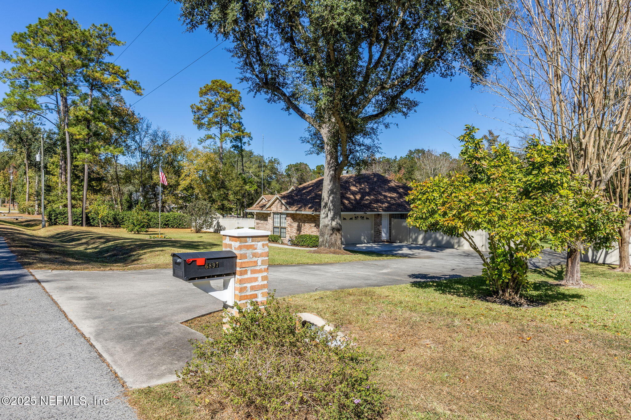 6897 Miltondale Road Macclenny, FL 32063 - Photo 43 of 58 a view of a yard with plants and trees