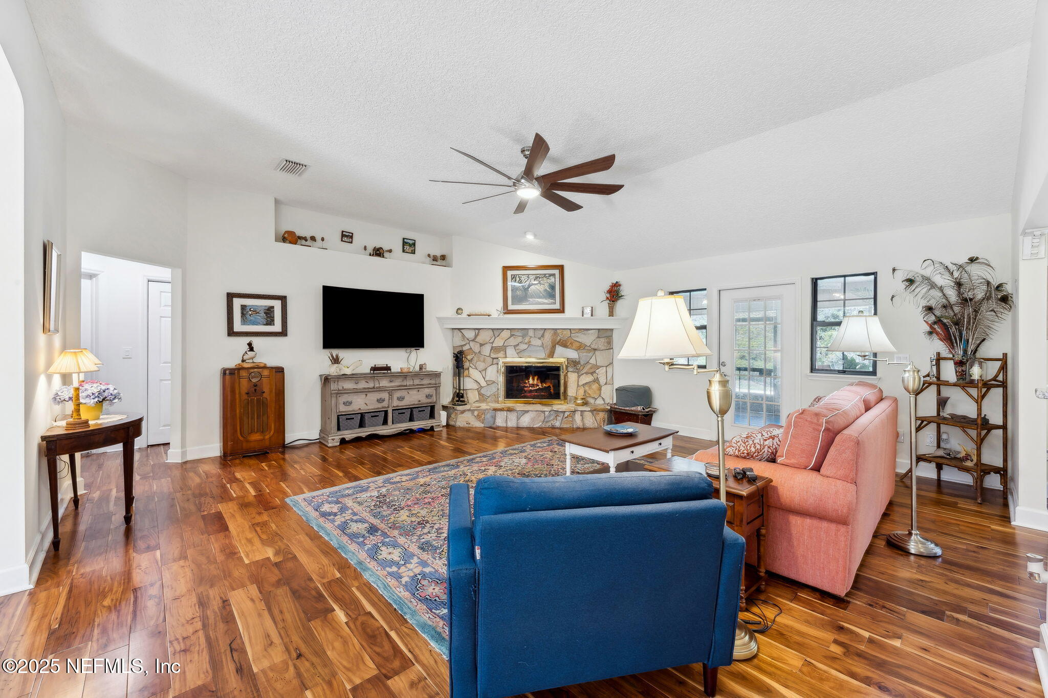 6897 Miltondale Road Macclenny, FL 32063 - Photo 10 of 58 a living room with fireplace furniture and a flat screen tv