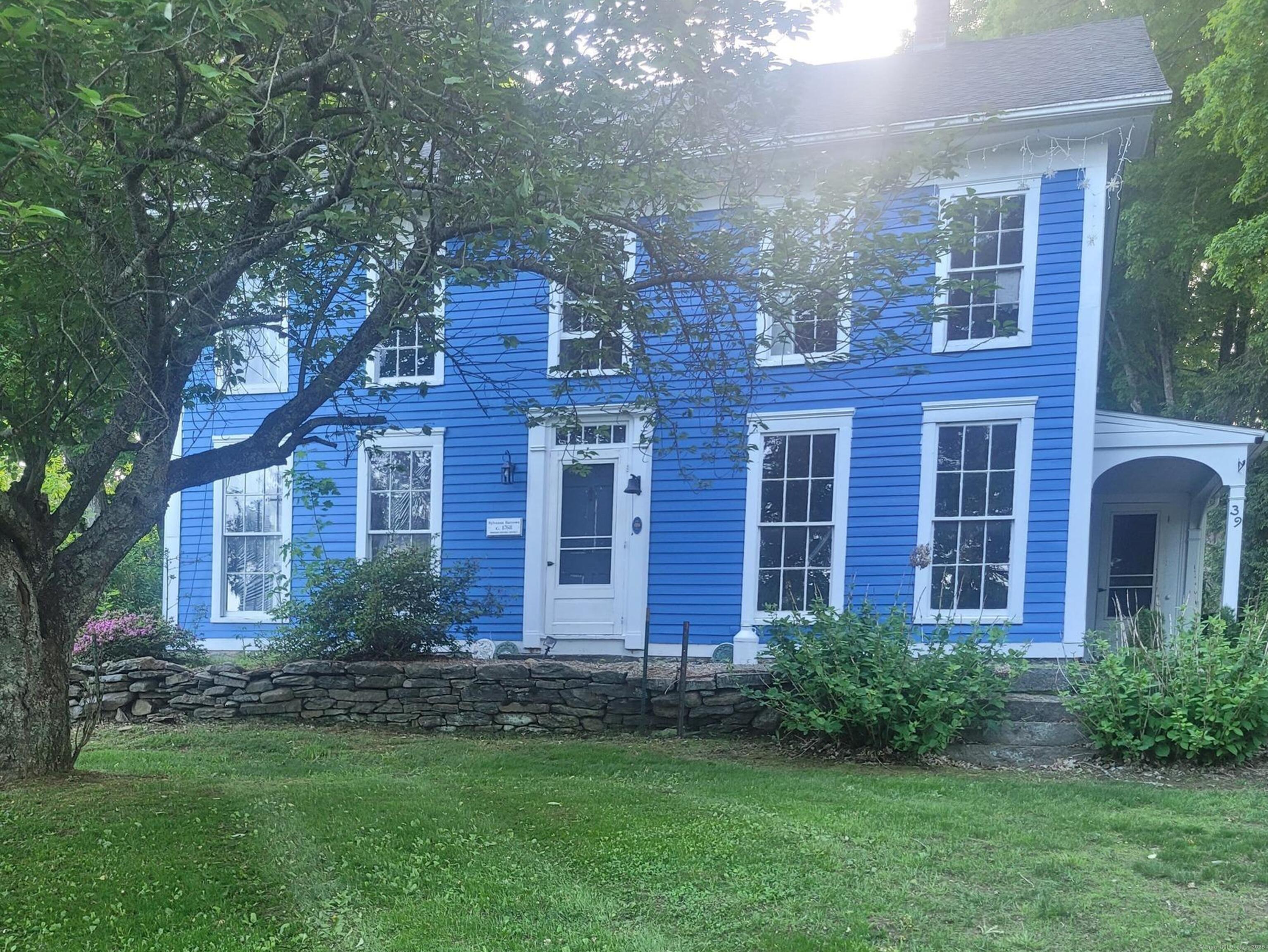39 Windham Center Road Windham, CT 06280 - Photo 1 of 1 a view of a brick building next to a yard