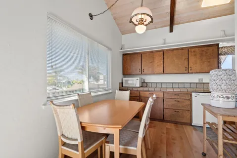 a view of a dining room with furniture window and outside view