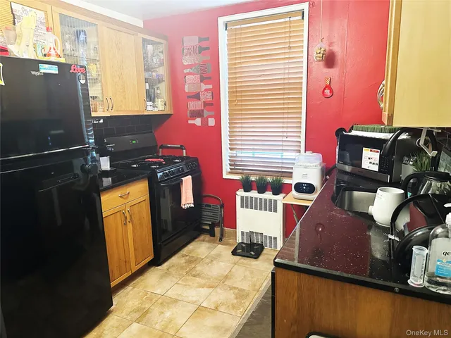 a kitchen with a stove and a refrigerator
