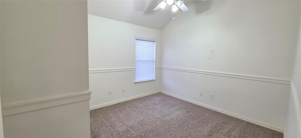 2697 Lake Ridge Drive Little Elm, TX 75068 - Photo 14 of 18 an empty room with a chandelier fan