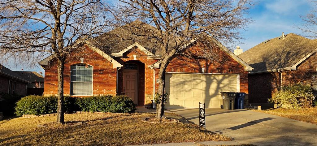 2697 Lake Ridge Drive Little Elm, TX 75068 - Photo 18 of 18 a front view of a house with garden