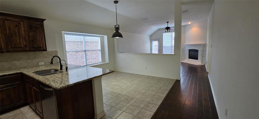 2697 Lake Ridge Drive Little Elm, TX 75068 - Photo 5 of 18 a kitchen with sink cabinets and window