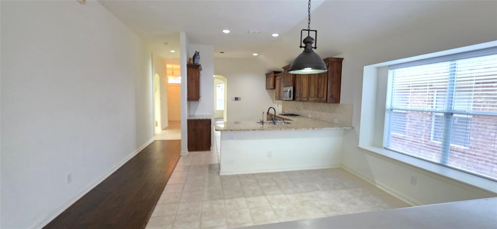 2697 Lake Ridge Drive Little Elm, TX 75068 - Photo 7 of 18 a living room with a large window