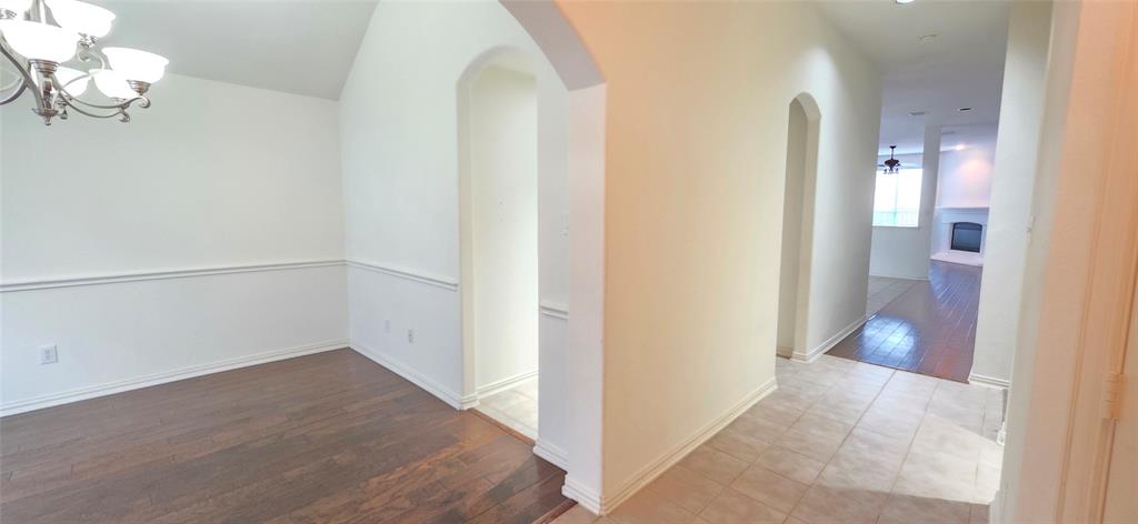 2697 Lake Ridge Drive Little Elm, TX 75068 - Photo 9 of 18 a view of a hallway with wooden floor