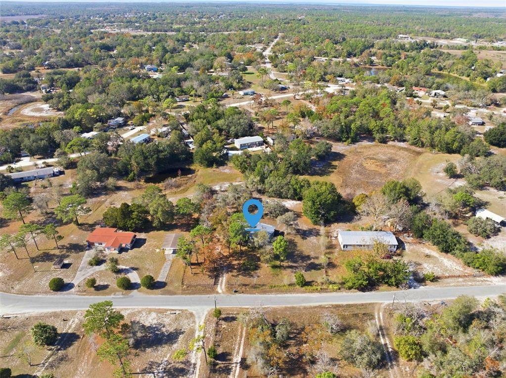 8045 Indian Trail Road Weeki Wachee, FL 34613 - Photo 47 of 49 an aerial view of residential houses with outdoor space
