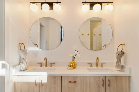 a bedroom with a bed and a mirror
