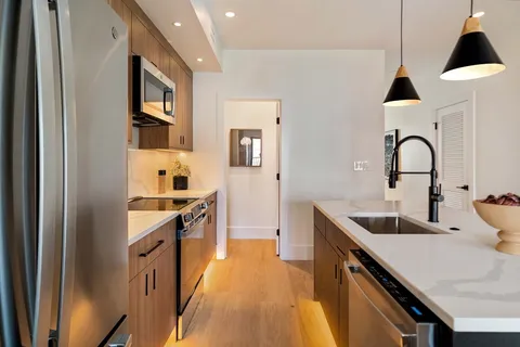 a kitchen with a stove and a microwave