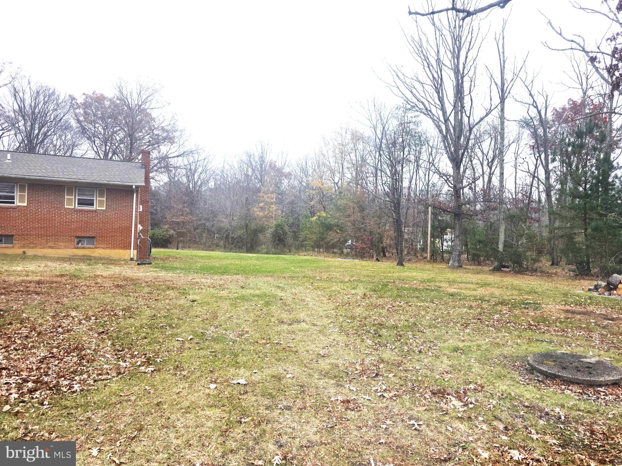 14300 South Springfield Road Brandywine, MD 20613 - Photo 2 of 2 a view of a yard with a house