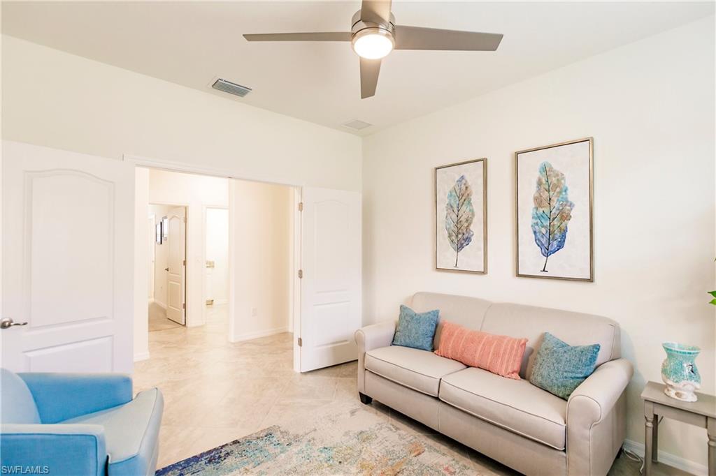 14360 Vindel Circle Fort Myers, FL 33905 - Photo 12 of 41 a living room with furniture and painting on the wall