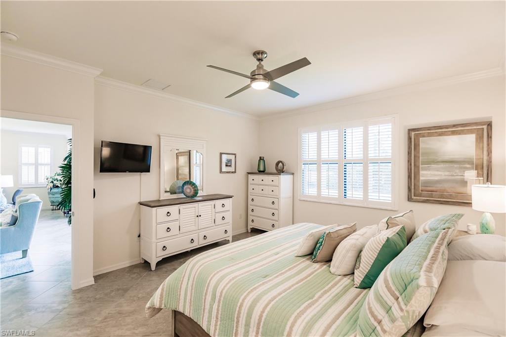 14360 Vindel Circle Fort Myers, FL 33905 - Photo 13 of 41 a bedroom with a bed and a flat screen tv