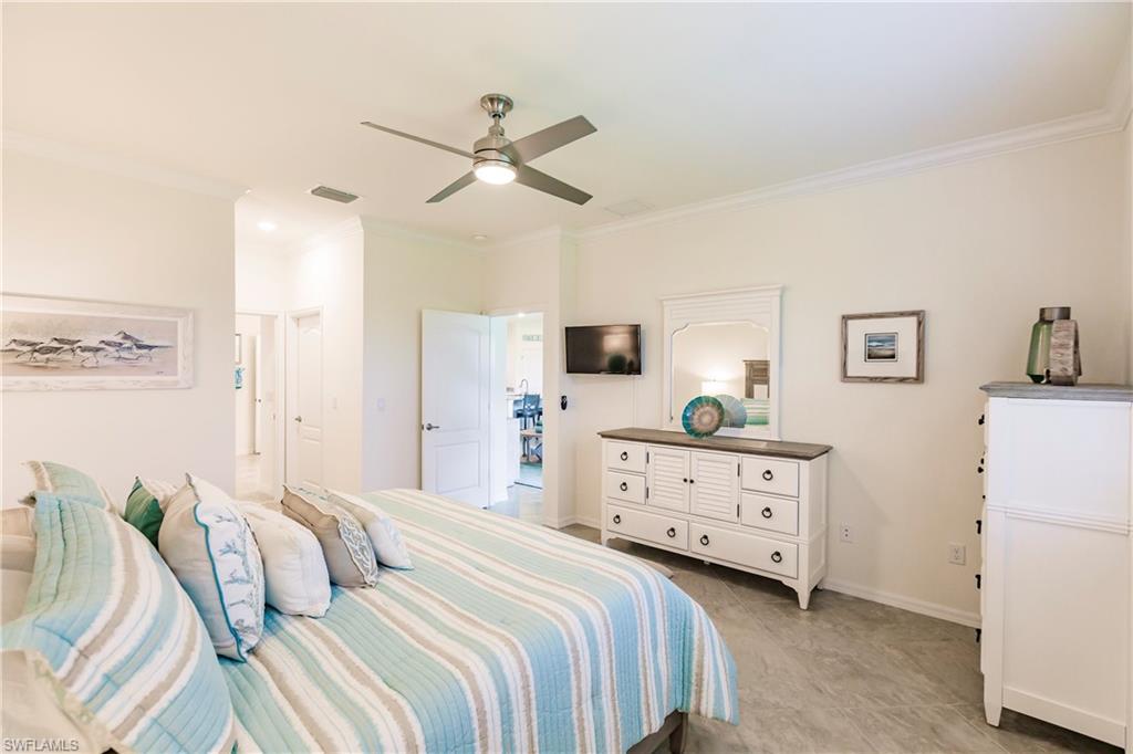14360 Vindel Circle Fort Myers, FL 33905 - Photo 14 of 41 a bedroom with a bed and a dresser