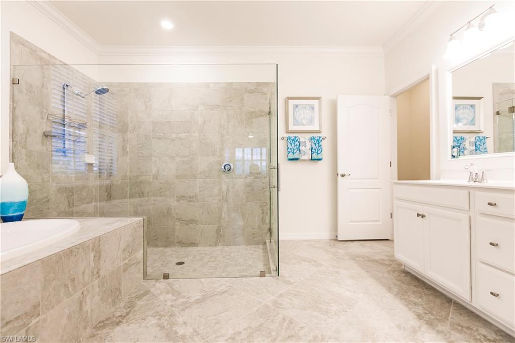 14360 Vindel Circle Fort Myers, FL 33905 - Photo 15 of 41 a bathroom with a shower sink and mirror