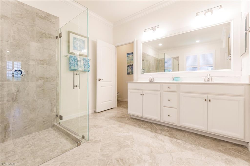 14360 Vindel Circle Fort Myers, FL 33905 - Photo 16 of 41 a spacious bathroom with a granite countertop sink mirror and shower