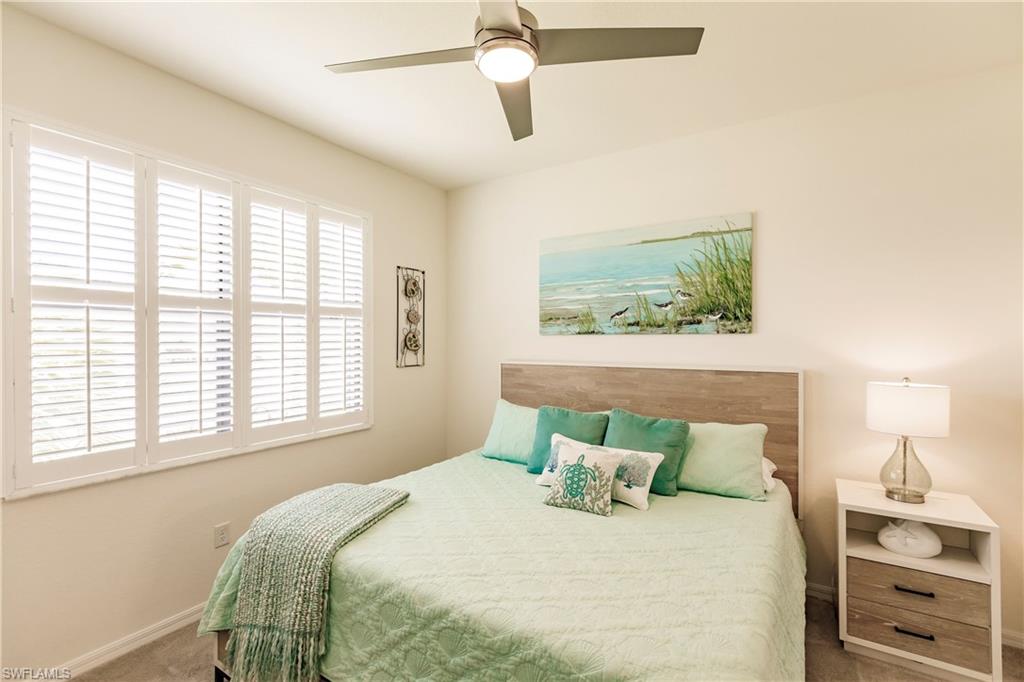 14360 Vindel Circle Fort Myers, FL 33905 - Photo 18 of 41 a bedroom with a bed and a window