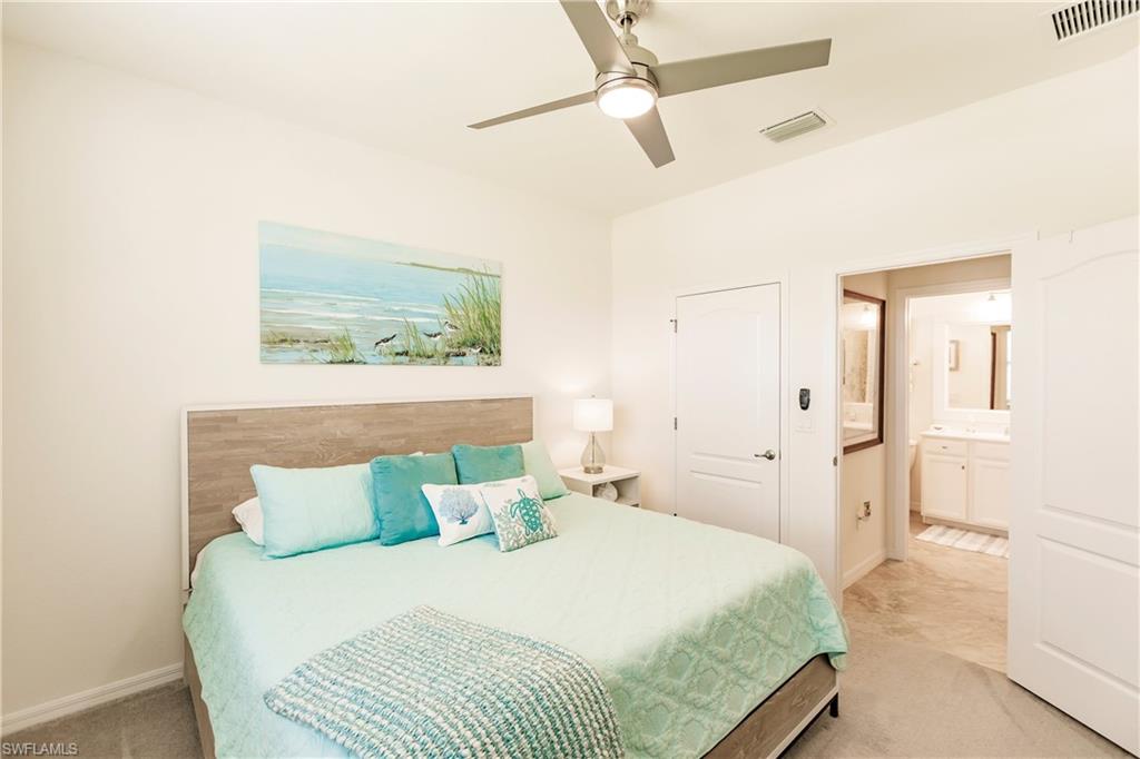 14360 Vindel Circle Fort Myers, FL 33905 - Photo 19 of 41 a bedroom with a bed and a painting on the wall