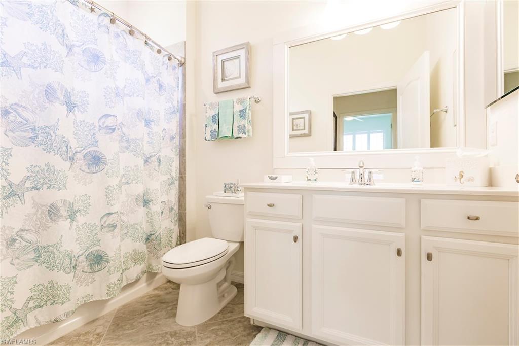 14360 Vindel Circle Fort Myers, FL 33905 - Photo 20 of 41 a bathroom with a sink toilet and mirror