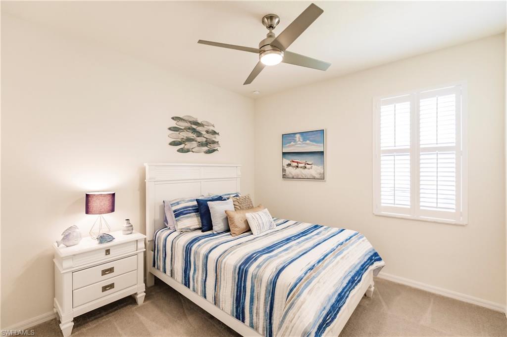 14360 Vindel Circle Fort Myers, FL 33905 - Photo 21 of 41 a bedroom with a bed and a window