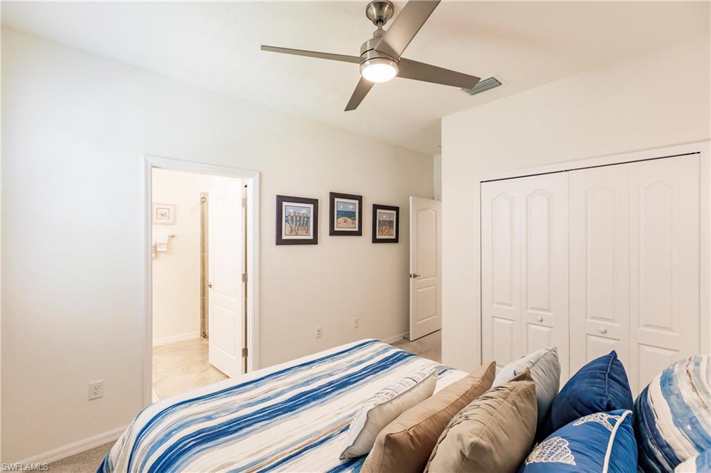 14360 Vindel Circle Fort Myers, FL 33905 - Photo 22 of 41 a bedroom with a bed and a painting on the wall