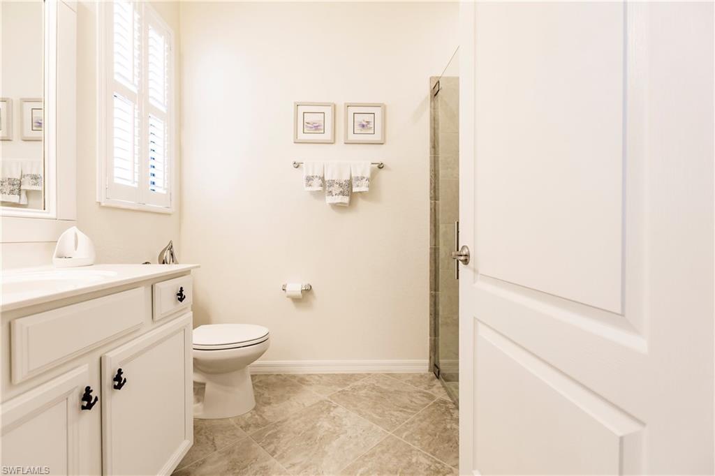 14360 Vindel Circle Fort Myers, FL 33905 - Photo 23 of 41 a bathroom with a toilet sink and a mirror