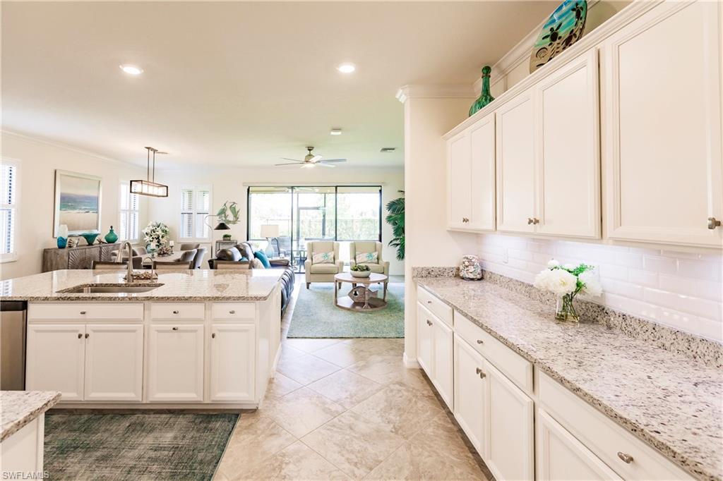14360 Vindel Circle Fort Myers, FL 33905 - Photo 3 of 41 a large white kitchen with granite countertop a sink and dishwasher with a white countertops