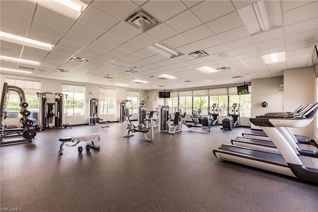 14360 Vindel Circle Fort Myers, FL 33905 - Photo 35 of 41 a gym room with lots of furniture and a chandelier