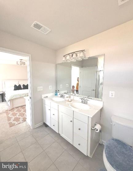 212 Landing Drive Fredericksburg, VA 22405 - Photo 24 of 42 a spacious bathroom with a double vanity sink a toilet and a mirror