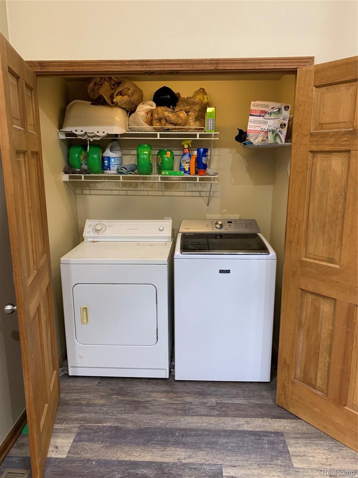 7078 Fargo Road Avoca, MI 48006 - Photo 24 of 41 Washer and Dryer neatly behind the doors in dining room