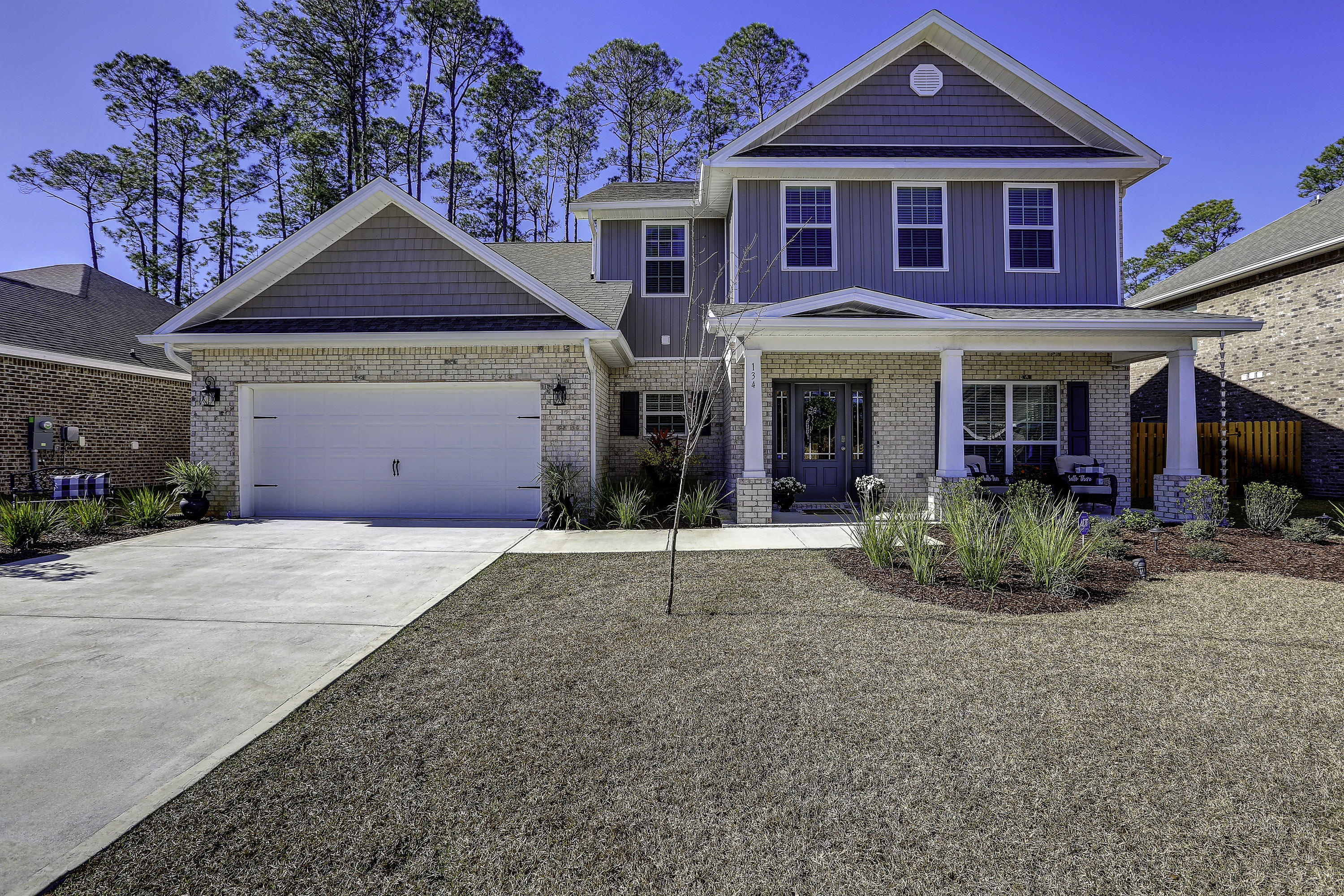 134 Conner Circle Santa Rosa Beach, FL 32459 - Photo 1 of 22 a front view of a house with garden