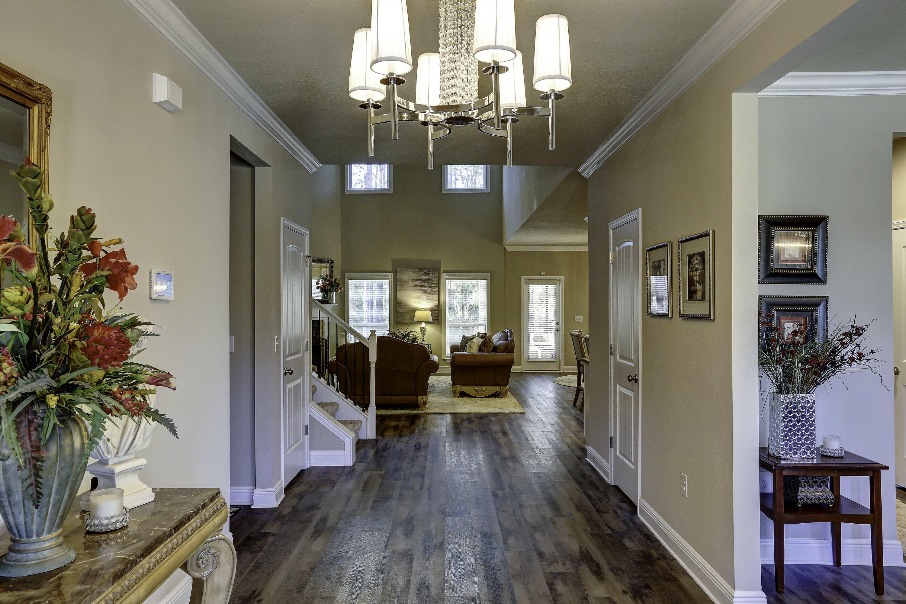134 Conner Circle Santa Rosa Beach, FL 32459 - Photo 3 of 22 a view of a dining room with furniture wooden floor and chandelier