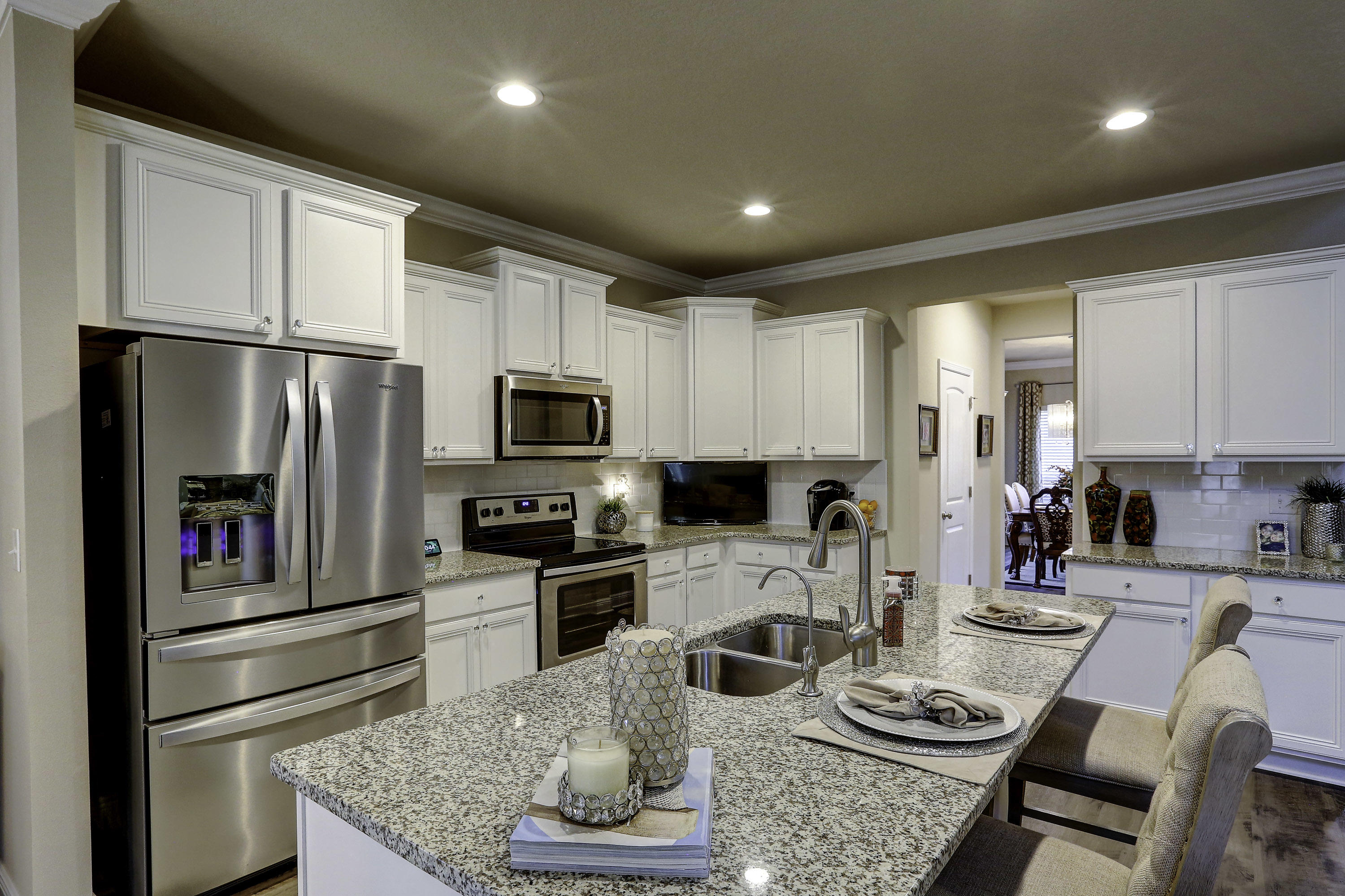 134 Conner Circle Santa Rosa Beach, FL 32459 - Photo 5 of 22 a kitchen with stainless steel appliances granite countertop a refrigerator stove microwave and cabinets