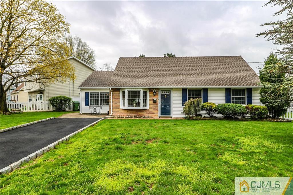 35 Stiles Road Edison, NJ 08817 - Photo 1 of 25 a front view of a house with a yard and garage