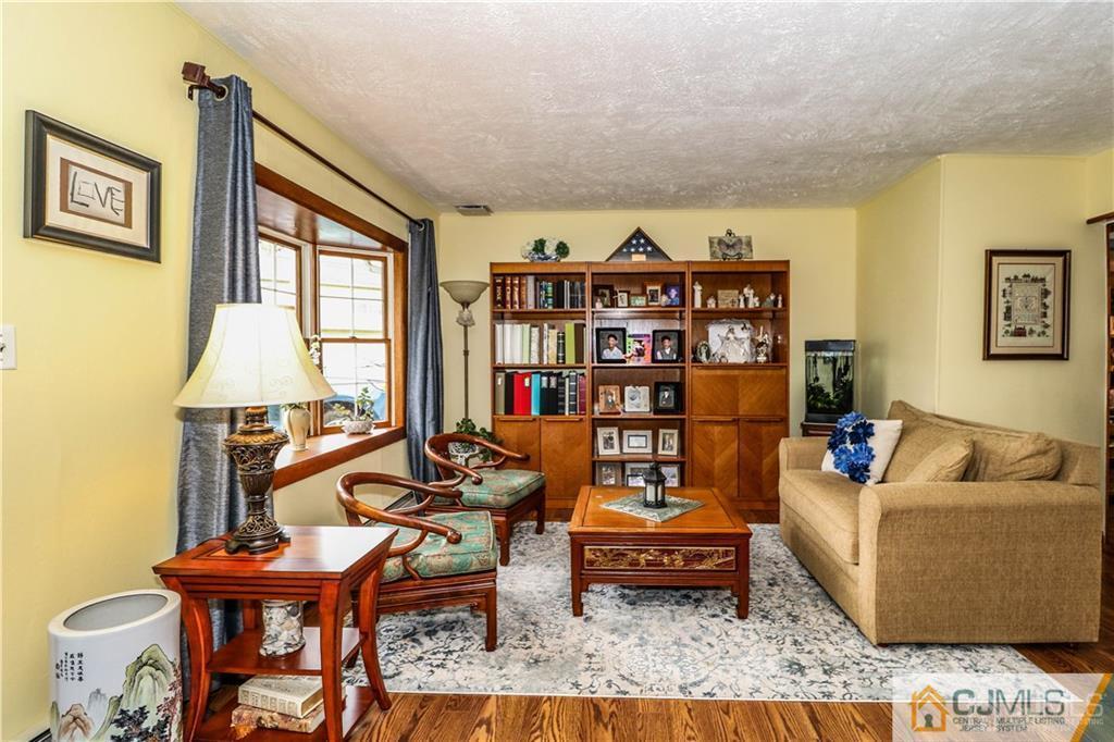 35 Stiles Road Edison, NJ 08817 - Photo 11 of 25 a living room with furniture and a window