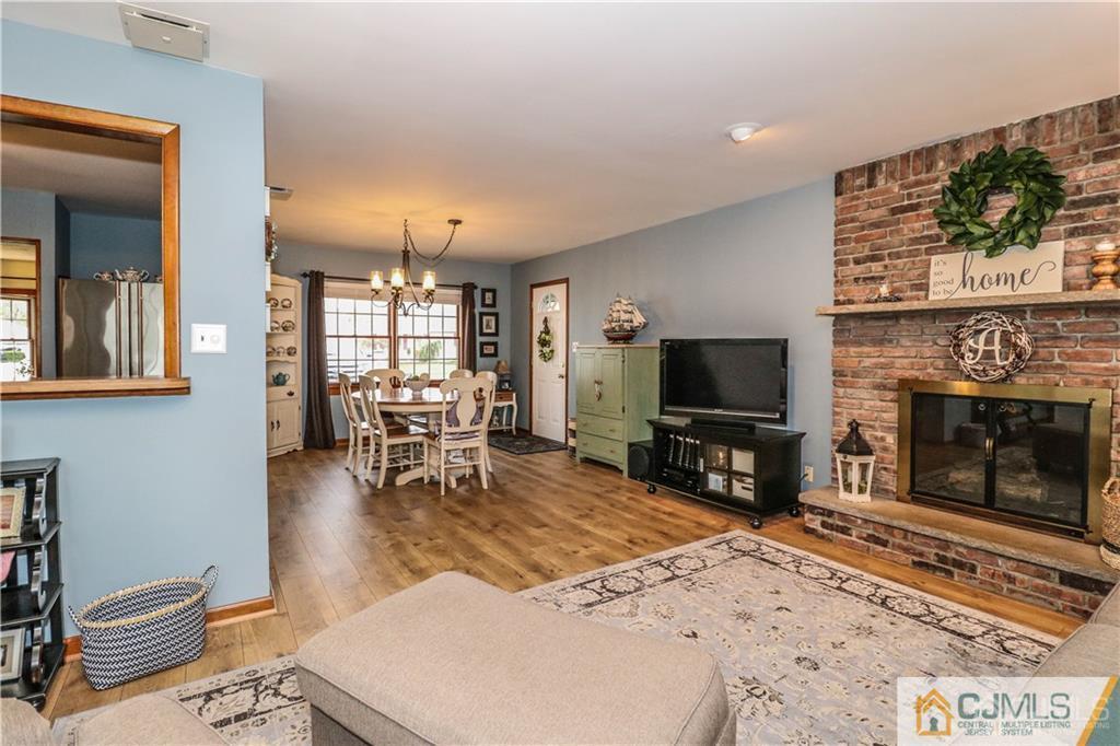 35 Stiles Road Edison, NJ 08817 - Photo 3 of 25 a living room with fireplace furniture and a flat screen tv