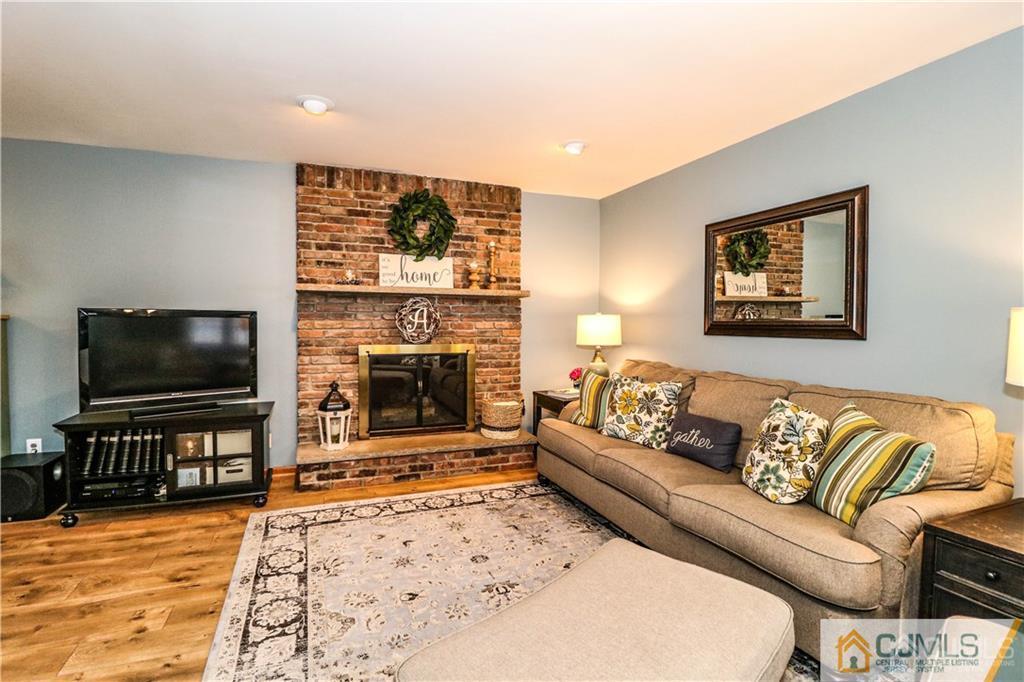 35 Stiles Road Edison, NJ 08817 - Photo 4 of 25 a living room with furniture and a flat screen tv
