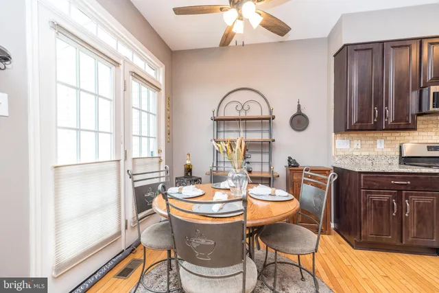 a view of a dining room with furniture window and outside view