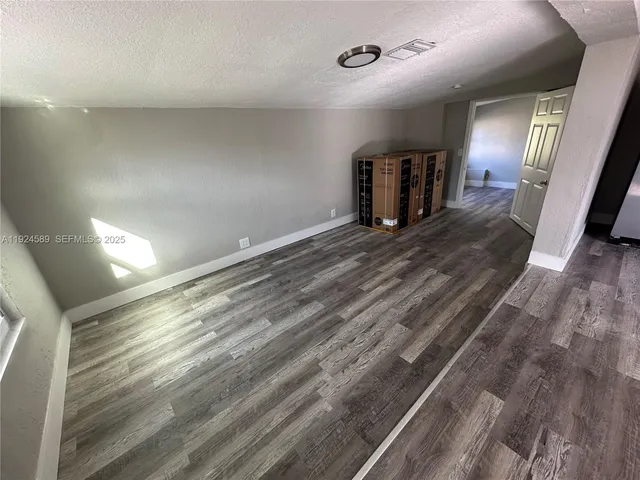 a view of a livingroom with wooden floor
