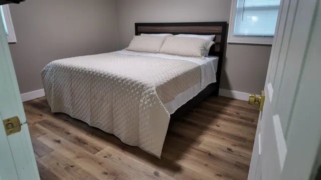 a bedroom with a bed and a television